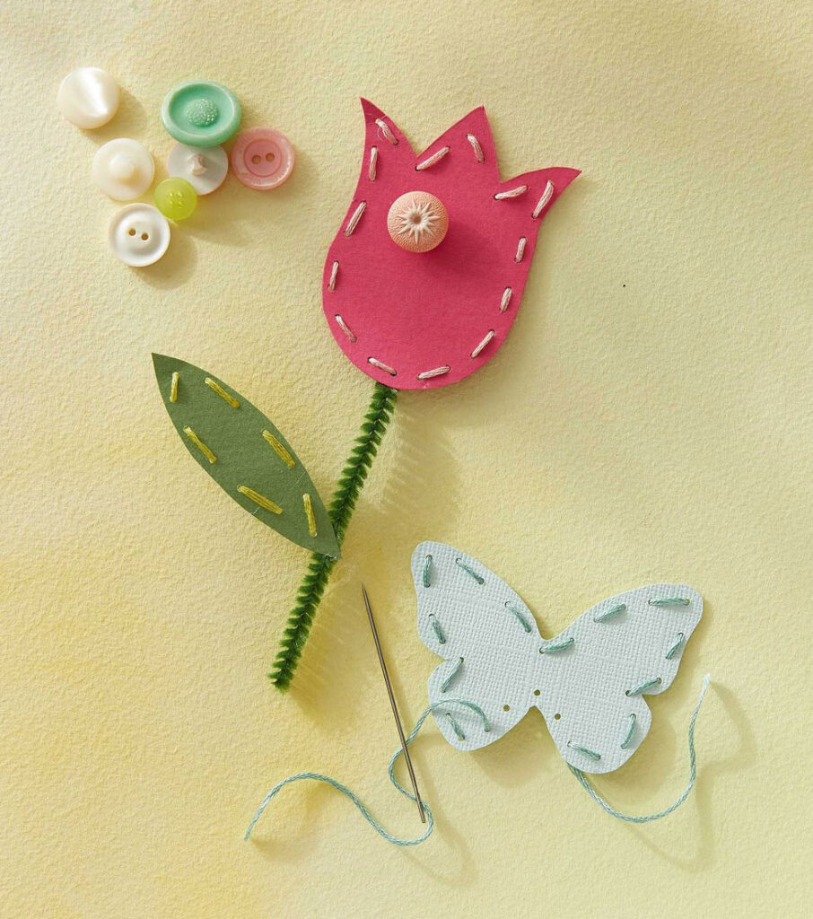 Craft projects using paper, pipe cleaners, thread, paper and buttons